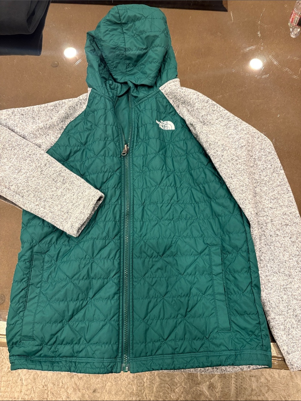 The North Face Teal Quilted Hooded Jacket with Light Gray Knit Sleeves